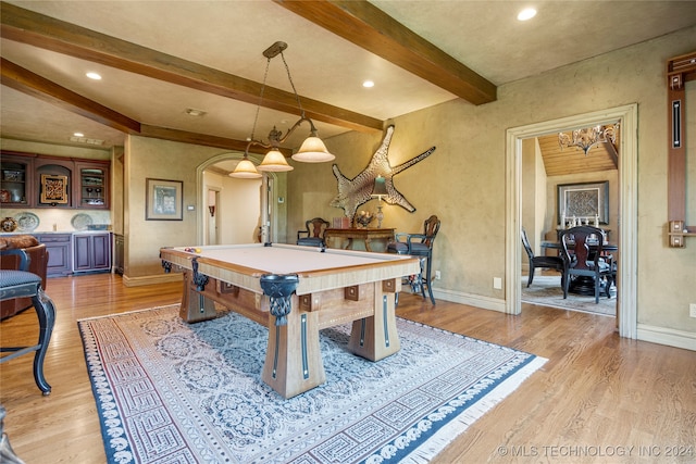 recreation room featuring pool table, beamed ceiling, and light hardwood / wood-style flooring