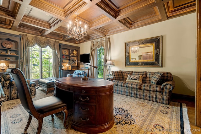 office space featuring hardwood / wood-style flooring, coffered ceiling, a chandelier, and ornamental molding