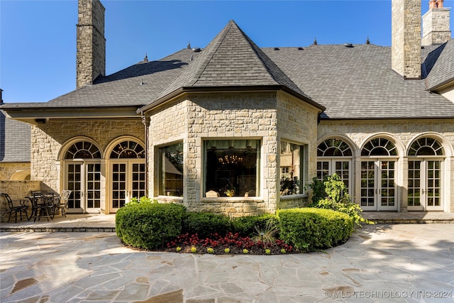 rear view of property with a patio and french doors