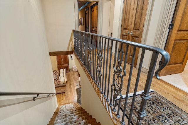 stairway with wood-type flooring