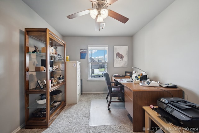 office area featuring ceiling fan and light carpet