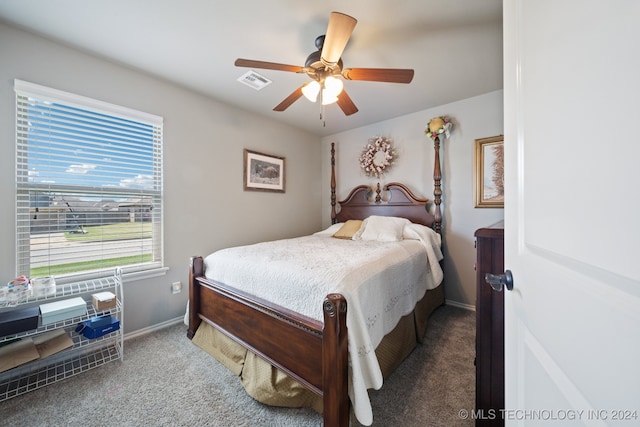 bedroom with ceiling fan and carpet floors