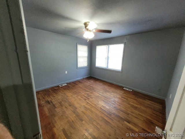 unfurnished room featuring ceiling fan and hardwood / wood-style floors