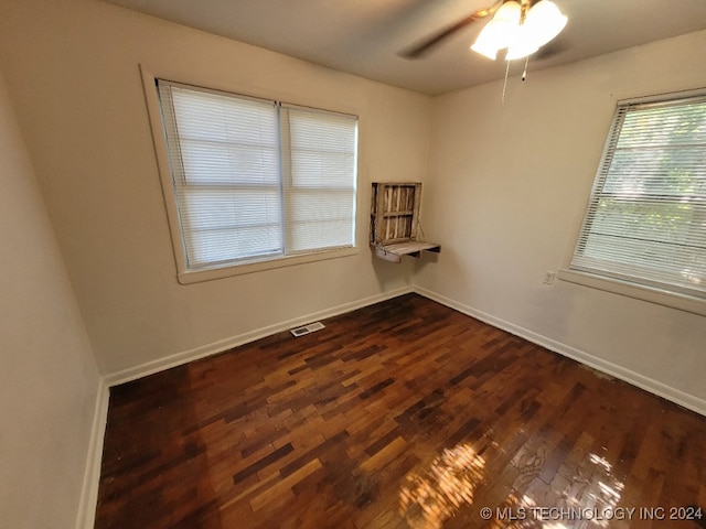 unfurnished room with ceiling fan and wood-type flooring