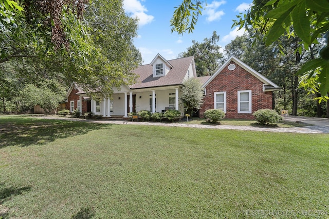 new england style home featuring a front lawn