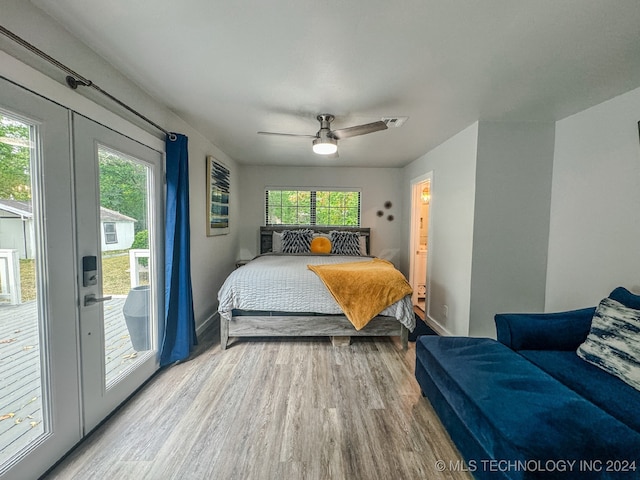 bedroom featuring light hardwood / wood-style floors, ceiling fan, and access to exterior