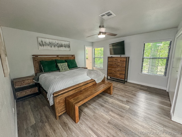 bedroom featuring ceiling fan and hardwood / wood-style flooring