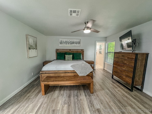 bedroom featuring light hardwood / wood-style flooring and ceiling fan