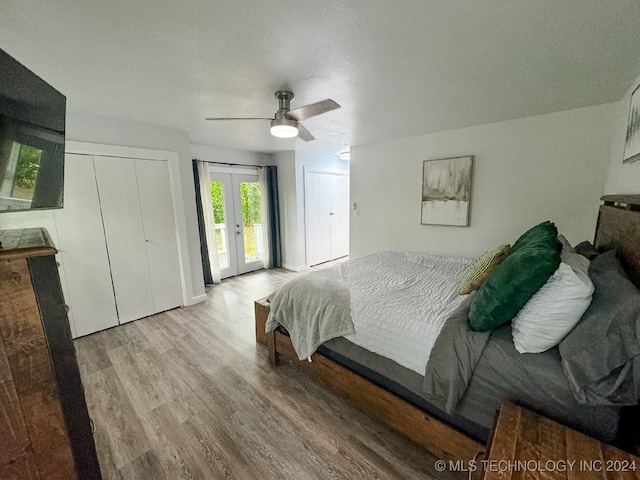 bedroom with a textured ceiling, access to outside, ceiling fan, and light hardwood / wood-style floors