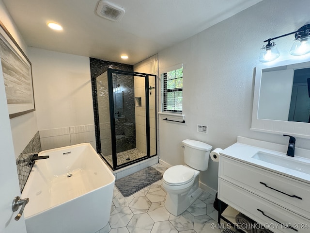 full bathroom with vanity, toilet, and shower with separate bathtub