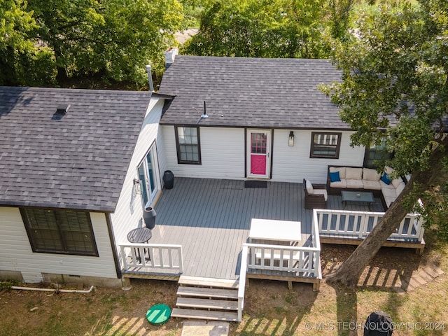 rear view of house featuring outdoor lounge area and a wooden deck