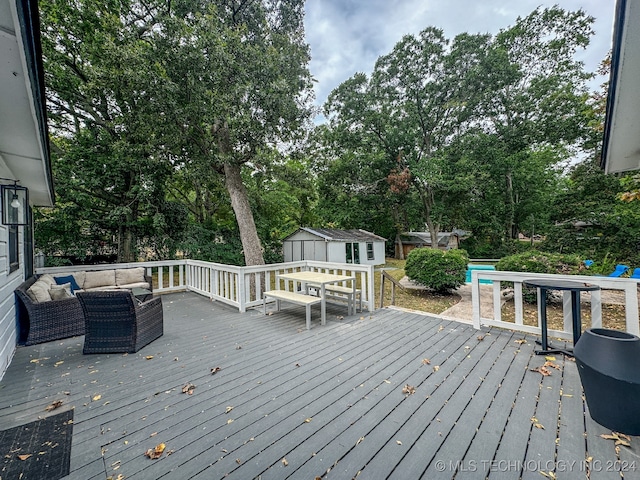 wooden deck featuring a shed