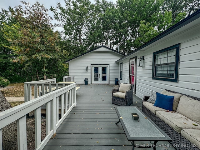 deck featuring outdoor lounge area and french doors