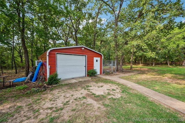 garage featuring a yard