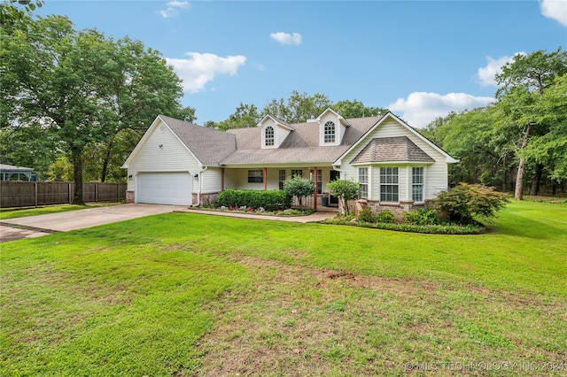 view of front of home with a garage and a front yard