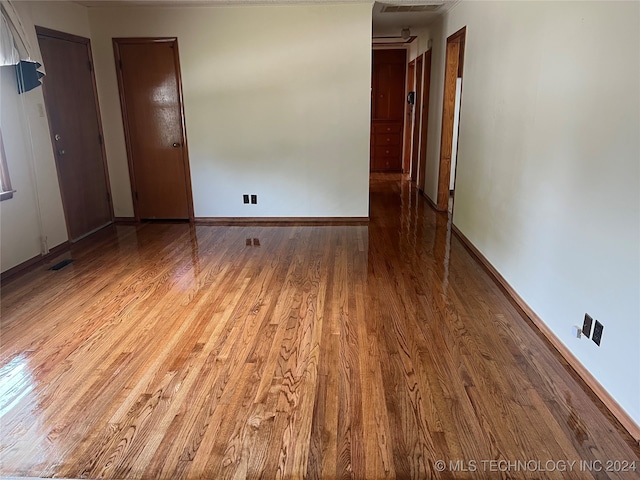 empty room featuring wood-type flooring