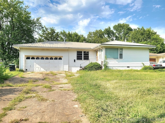 view of front of property featuring crawl space, metal roof, concrete driveway, and an attached garage