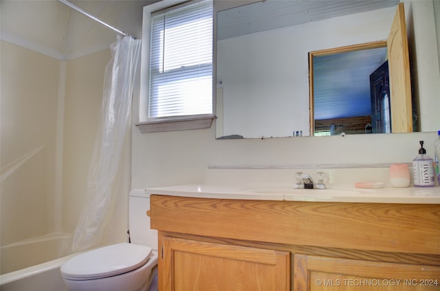 full bathroom featuring toilet, vanity, and shower / tub combo