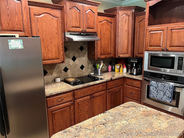 kitchen featuring light stone countertops, appliances with stainless steel finishes, crown molding, and tasteful backsplash