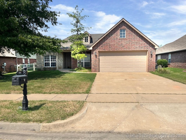 traditional home with an attached garage, brick siding, concrete driveway, and a front yard