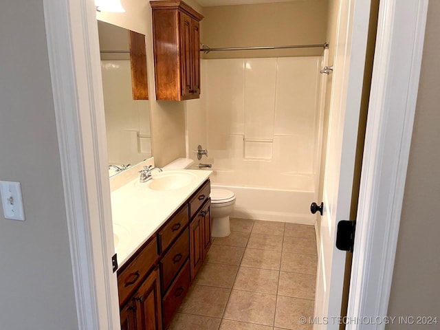 full bathroom with shower / tub combination, toilet, a sink, tile patterned floors, and double vanity