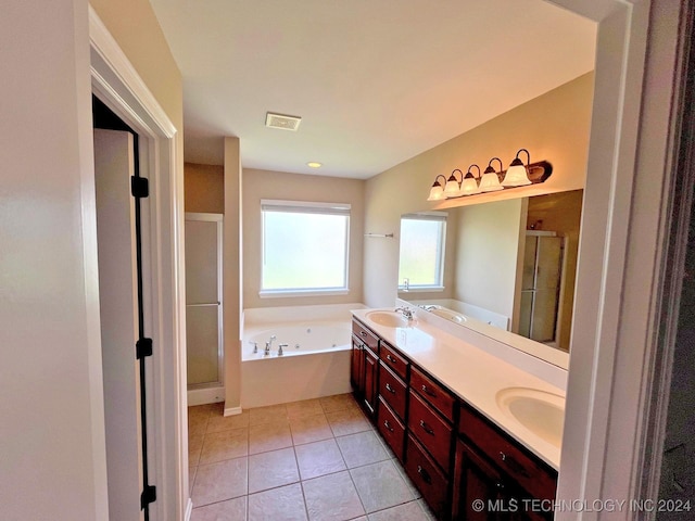 full bathroom featuring double vanity, visible vents, a stall shower, a sink, and tile patterned flooring