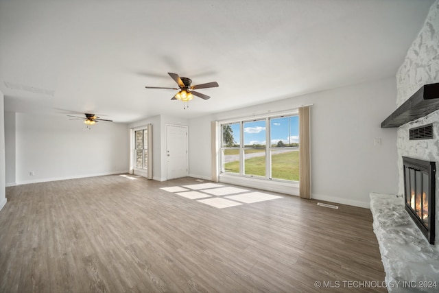 empty room featuring hardwood / wood-style flooring and ceiling fan