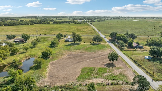 birds eye view of property featuring a rural view