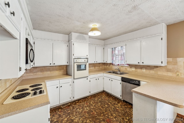 kitchen featuring white cabinets, kitchen peninsula, backsplash, and appliances with stainless steel finishes