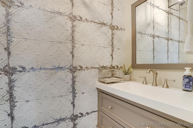 bathroom featuring tile walls and vanity