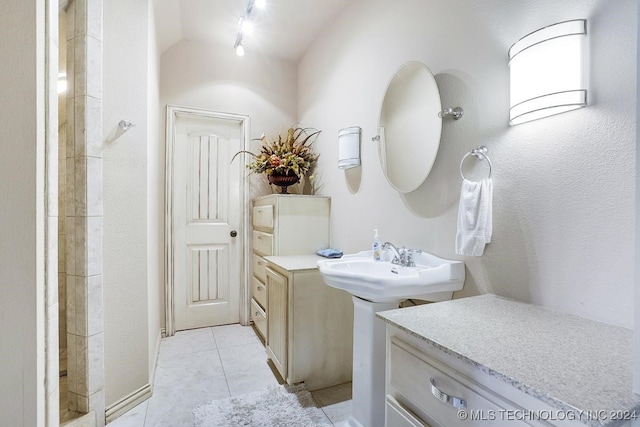 bathroom featuring tile patterned flooring and track lighting