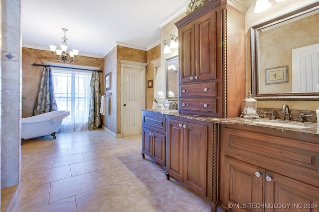 bathroom featuring a chandelier, a bathing tub, vanity, tile patterned floors, and crown molding