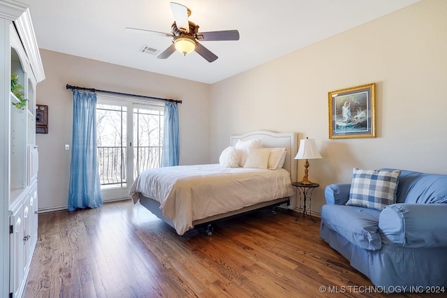 bedroom with hardwood / wood-style flooring, access to exterior, and ceiling fan