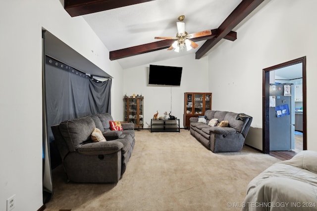 living room with carpet, vaulted ceiling with beams, and ceiling fan