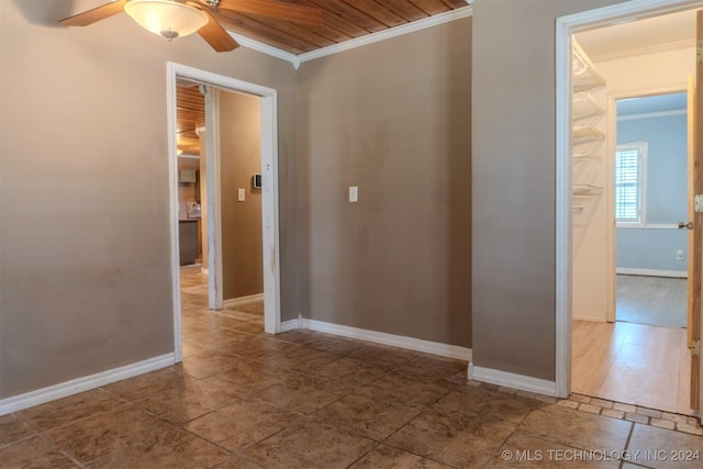 corridor featuring ornamental molding and hardwood / wood-style flooring