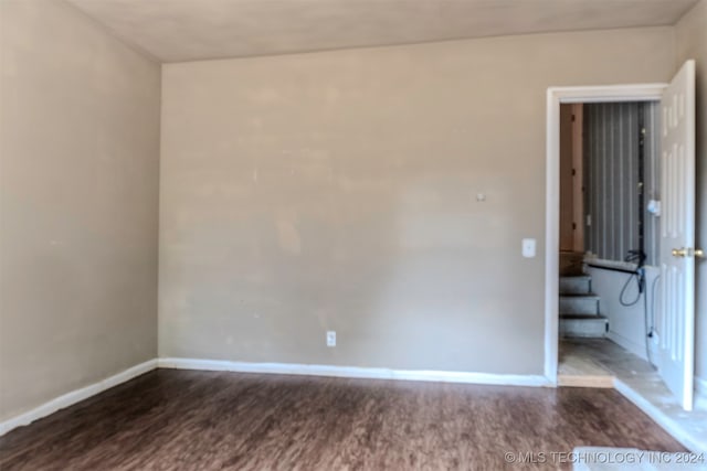 unfurnished room with hardwood / wood-style floors