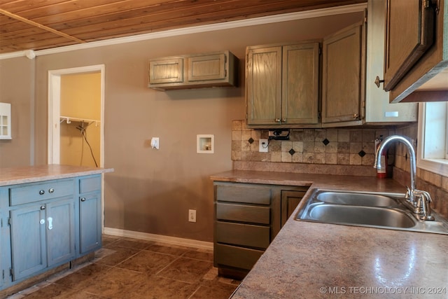 kitchen with wood ceiling, ornamental molding, sink, and decorative backsplash