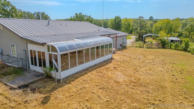 rear view of house with a sunroom