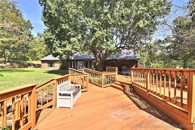 deck with a lawn and a sunroom