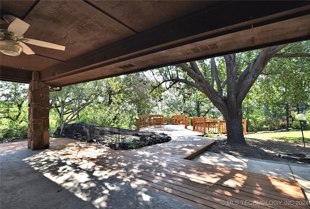 view of patio / terrace featuring ceiling fan and a deck