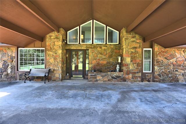 view of exterior entry featuring stone siding