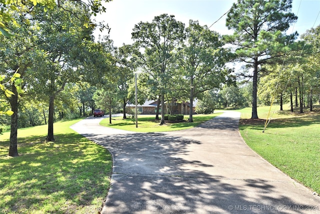 view of home's community featuring a lawn