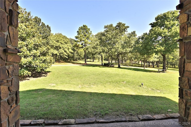 view of home's community featuring a yard