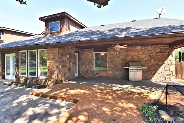 rear view of property with a patio area and a wooden deck