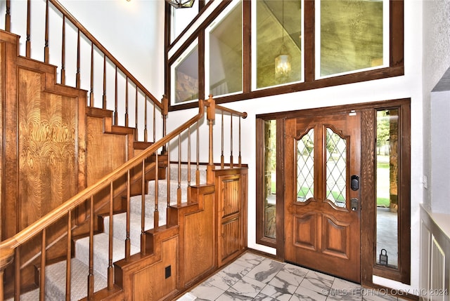 entrance foyer featuring a towering ceiling