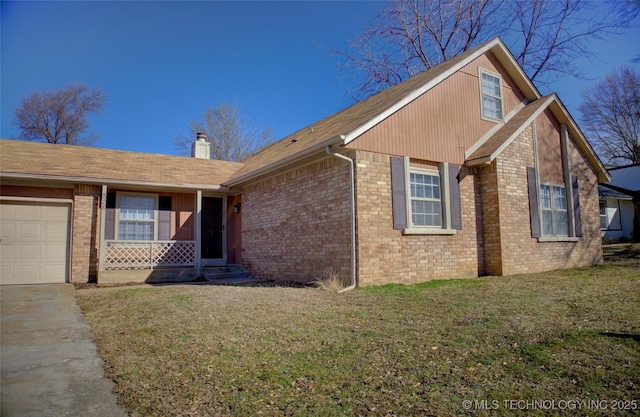 view of front of house with a garage and a front yard