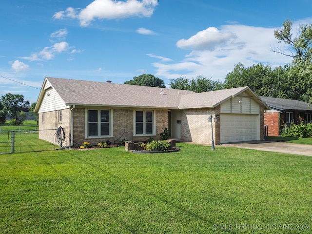 single story home with a front lawn and a garage