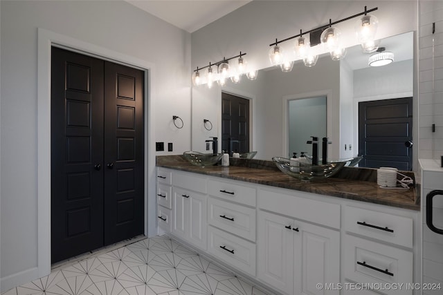 bathroom featuring double vanity and a sink