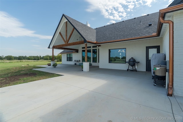 back of property with a patio