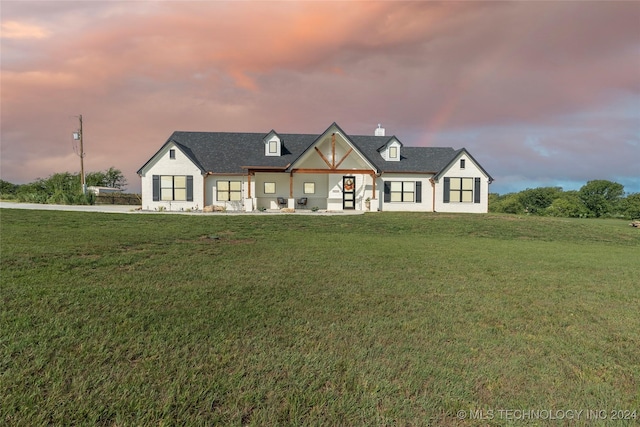 view of front of home with a lawn